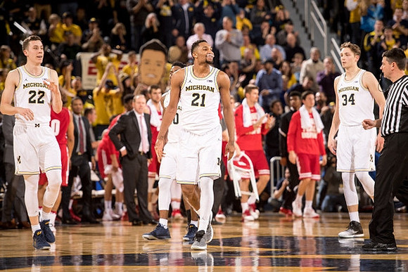 Duncan Robinson (22), Zak Irvin (21), and Mark Donnal (34)