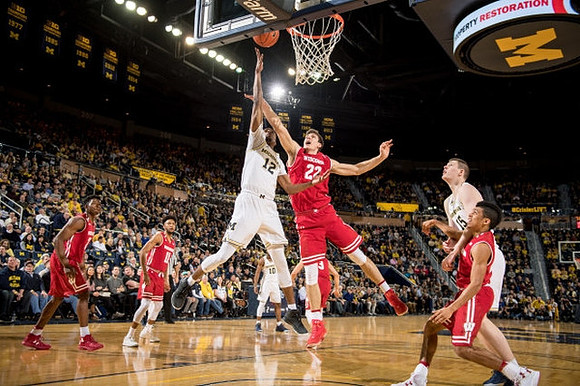 Muhammad-Ali Abdur-Rahkman (12), Derrick Walton Jr. (10), and Jon Teske (15)