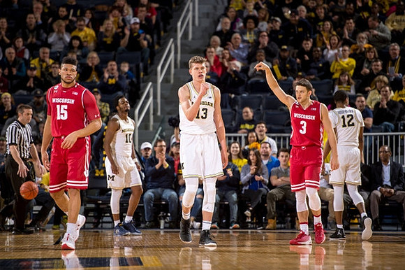 Derrick Walton Jr. (10), Moritz Wagner (13), and Muhammad-Ali Abdur-Rahkman (12)