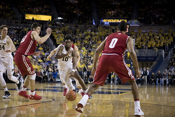 Mark Donnal (34) and Derrick Walton Jr. (10)