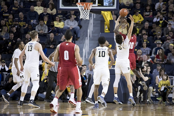 Muhammad-Ali Abdur-Rahkman (12), Moritz Wagner (13), Derrick Walton Jr. (10), and D.J. Wilson (5)