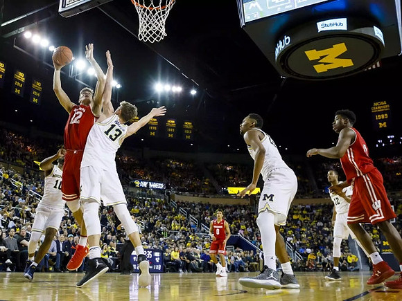 Derrick Walton Jr. (10), Moritz Wagner (13), Zak Irvin (21), and Muhammad-Ali Abdur-Rahkman (12)