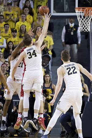 Zak Irvin (21), Mark Donnal (34), and Duncan Robinson (22)