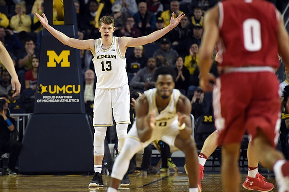 Moritz Wagner (13) and Derrick Walton Jr. (10)