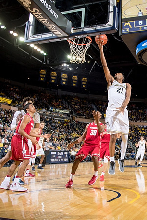 D.J. Wilson (5), Zak Irvin (21), and Moritz Wagner (13)