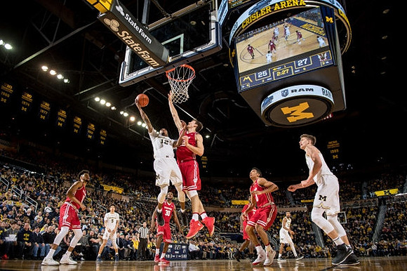 D.J. Wilson (5), Muhammad-Ali Abdur-Rahkman (12), Zak Irvin (21), and Moritz Wagner (13)