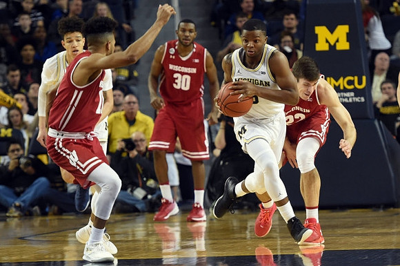 D.J. Wilson (5) and Xavier Simpson (3)