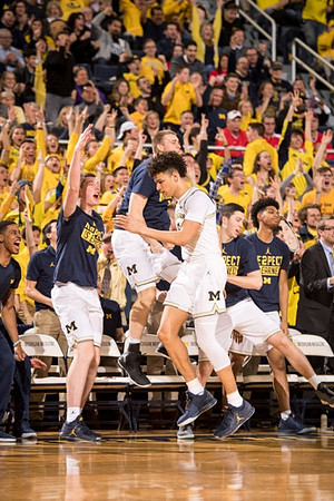 D.J. Wilson (5) and Michigan Team