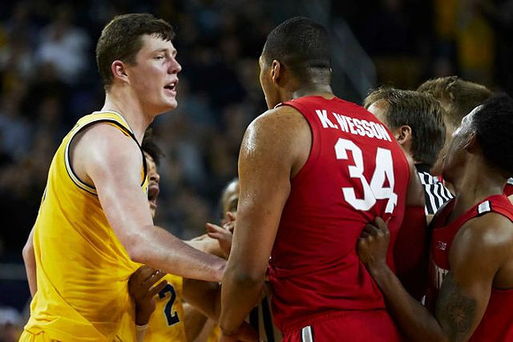 Jon Teske (15) and Jordan Poole (2)