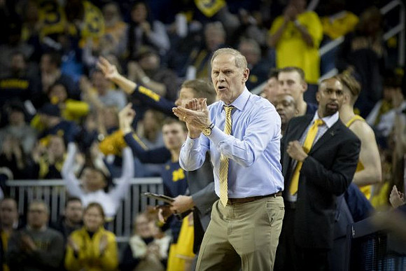 John Beilein, Luke Yaklich, and Saddi Washington