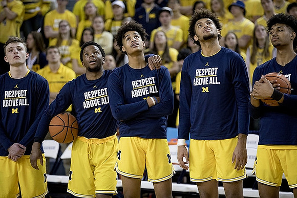 Luke Wilson (11), Zavier Simpson (3), Jordan Poole (2), Isaiah Livers (4), and Ibi Watson (23)