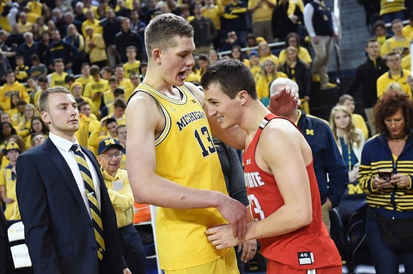 Moritz Wagner (13) and Former Michigan Player Andrew Dakich (13)