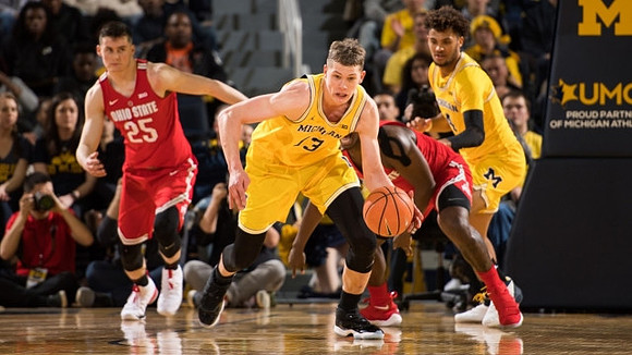 Moritz Wagner (13) and Isaiah Livers (4)