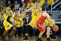Moritz Wagner (13), Zavier Simpson (3), and Former Michigan Player Andrew Dakich (13)