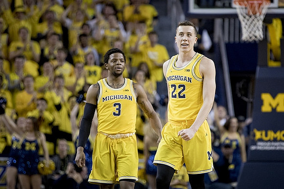 Zavier Simpson (3) and Duncan Robinson (22)