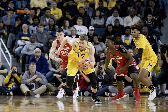 Moritz Wagner (13) and Isaiah Livers (4)