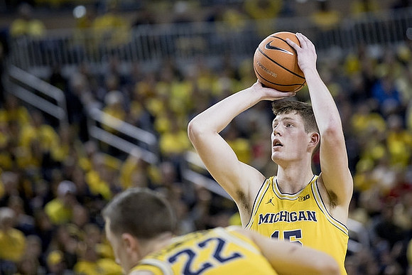 Duncan Robinson (22) and Jon Teske (15)