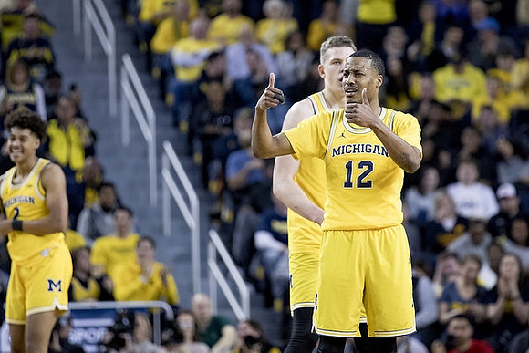 Jordan Poole (2), Moritz Wagner (13), and Muhammad-Ali Abdur-Rahkman (12)