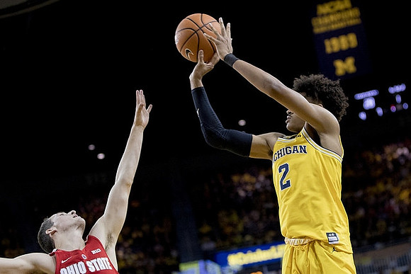 Jordan Poole (2) and Former Michigan Player Andrew Dakich (13)