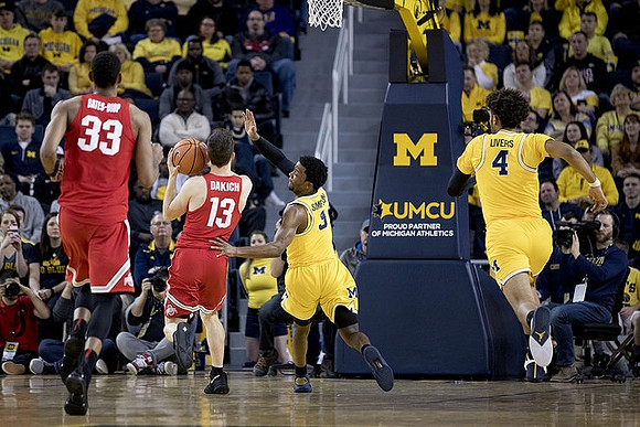 Zavier Simpson (3) and Isaiah Livers (4)