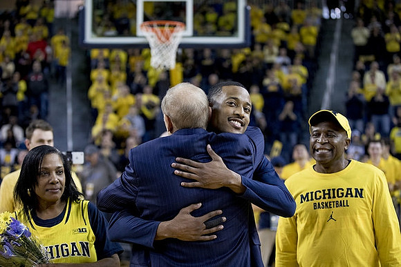 Muhammad-Ali Abdur-Rahkman (12) and John Beilein