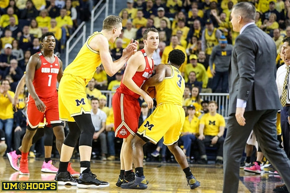 Moritz Wagner (13), Zavier Simpson (3), and Ohio State Head Coach Chris Holtmann