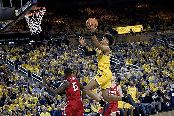 Jordan Poole (2), Zavier Simpson (3), and Former Michigan Player Andrew Dakich (13)