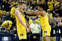 Moritz Wagner (13) and Jordan Poole (2)