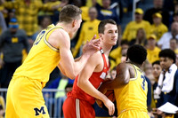 Moritz Wagner (13), Zavier Simpson (3), and Former Michigan Player Andrew Dakich (13)