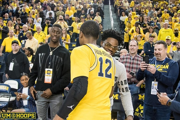 Muhammad-Ali Abdur-Rahkman (12) and Former Michigan Players Caris LeVert and Derrick Walton Jr.