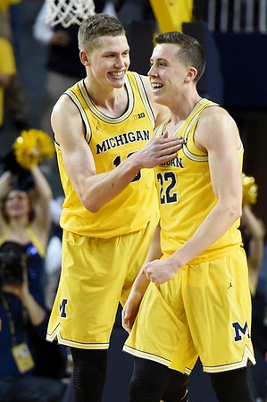 Moritz Wagner (13) and Duncan Robinson (22)