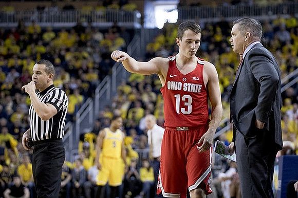 Former Michigan Player Andrew Dakich (13) and Ohio State Head Coach Chris Holtmann