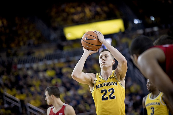 Duncan Robinson (22) and Zavier Simpson (3)