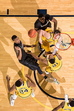 Aubrey Dawkins (24), Zak Irvin (21), and Ricky Doyle (32)