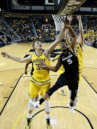Mark Donnal (34) and Spike Albrecht (2)
