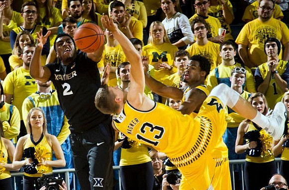 Moritz Wagner (13) and Derrick Walton Jr. (10)