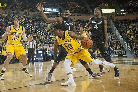 Ricky Doyle (32) and Derrick Walton Jr. (10)