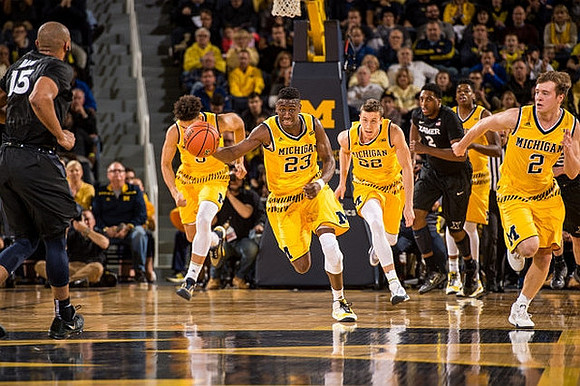 D.J. Wilson (5), Caris LeVert (23), Duncan Robinson (22), Kameron Chatman (3), and Spike Albrecht (2)