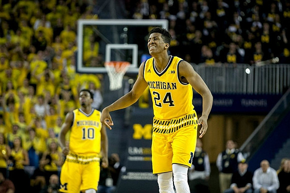 Derrick Walton Jr. (10) and Aubrey Dawkins (24)