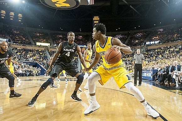 Aubrey Dawkins (24) and Derrick Walton Jr. (10)
