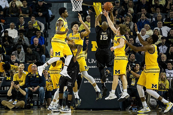 Derrick Walton Jr. (10), D.J. Wilson (5), Spike Albrecht (2), and Kameron Chatman (3)
