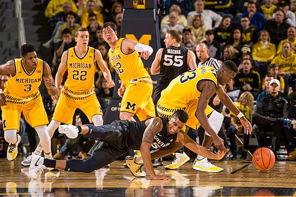 Kameron Chatman (3), Duncan Robinson (22), Ricky Doyle (32), and Caris LeVert (23)