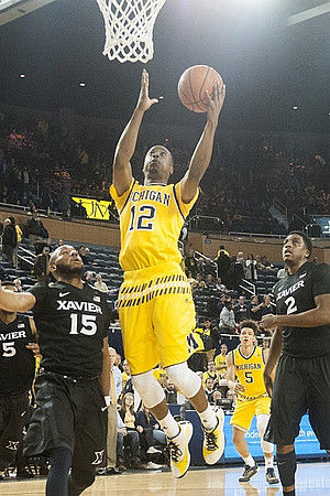 Muhammad-Ali Abdur-Rahkman (12) and D.J. Wilson (5)