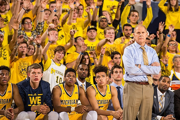 Aubrey Dawkins (24), Moritz Wagner (13), Kameron Chatman (3), D.J. Wilson (5), John Beilein, and LaVall Jordan