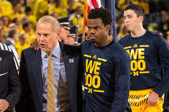 John Beilein, Derrick Walton Jr. (10), and Sean Lonergan (20)