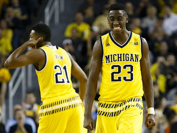 Zak Irvin (21) and Caris LeVert (23)