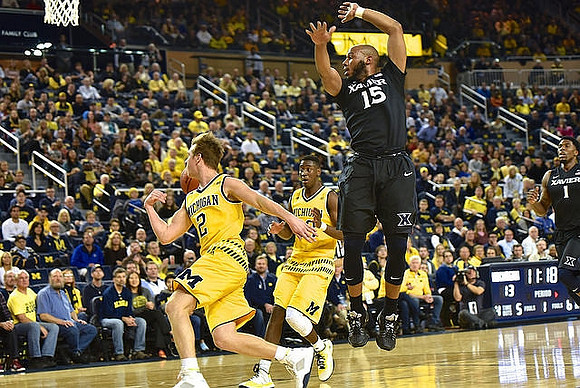 Spike Albrecht (2) and Caris LeVert (23)