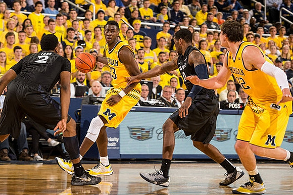 Caris LeVert (23) and Ricky Doyle (32)