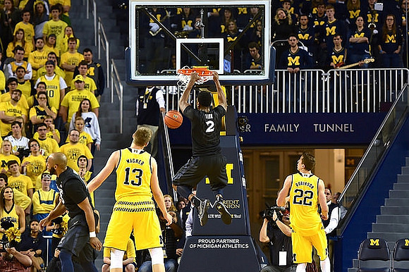 Moritz Wagner (13) and Duncan Robinson (22)