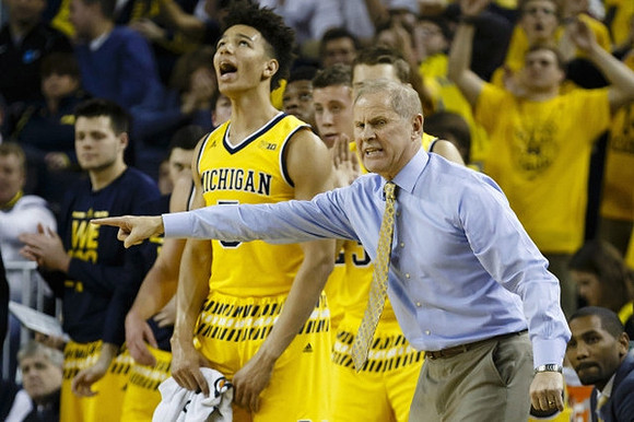 D.J. Wilson (5) and John Beilein